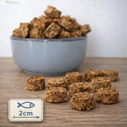Fischtaler Dorsch mit Lachs von NANDOO, 250g, frisch zubereitet mit Fischfilets und Lachs auf einem Teller.
